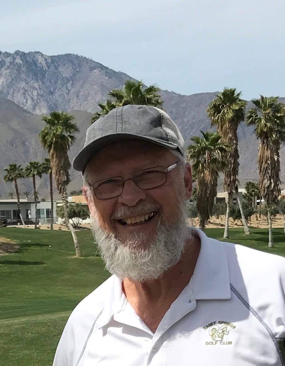 Ken Saik smiling outdoors